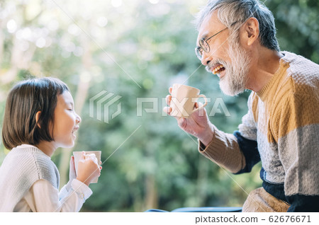 Grandpa and grandchild tea time 62676671