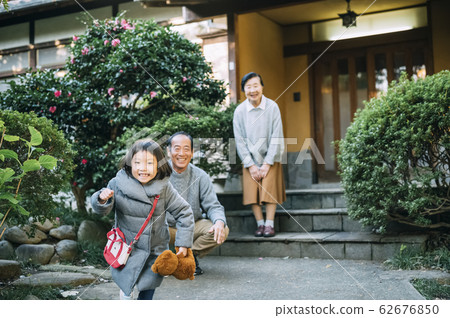 Senior, husband and wife, grandchild 62676850