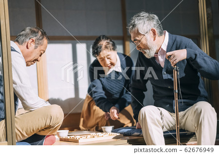 Senior man playing shogi Senior man playing shogi 62676949