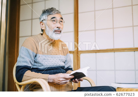 Senior men reading a book Senior men reading a book 62677023