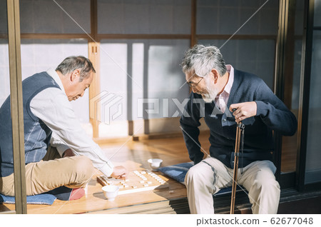 Senior man playing shogi Senior man playing shogi 62677048