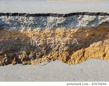 The layer of asphalt road with soil and gravel. The layer of asphalt road with soil and gravel. 62678048
