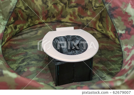 portable toilets in tent at camping public 62679007