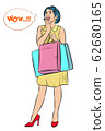 Young women enjoy shopping, She is excited to see Discounts for many  products. 62680165