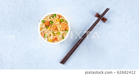 Ramen cup panoramic overhead shot, instant soba noodles in a plastic cup, with copy space 62682412
