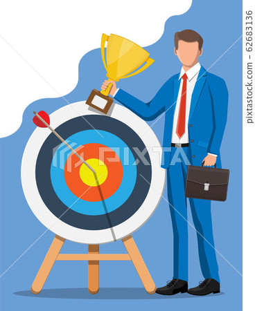 Businessman with trophy, dart target 62683136