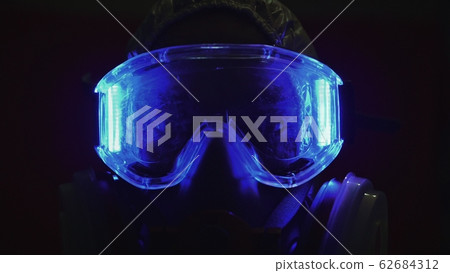 Man in protective costume suit, gas protect medical spray paint mask. Doctor in respirator. Concept health virus coronavirus epidemic. 62684312
