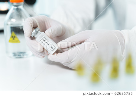 Professional researcher studying antiviral pharmacy in the lab 62685785