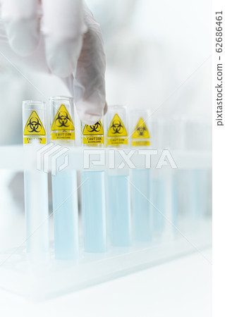 Close up of hand that taking test tube Close up of hand that taking test tube 62686461