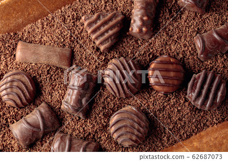 Chocolate candies and chocolate chips. Chocolate candies and chocolate chips. 62687073