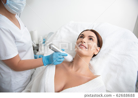 Therapist make anti-age massage of neck to female 62688688