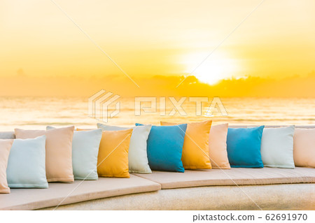 Comfortable pillow on sofa chair around outdoor patio with sea ocean beach view Comfortable pillow on sofa chair around outdoor patio with sea ocean beach view 62691970