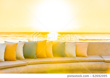 Comfortable pillow on sofa chair around outdoor patio with sea ocean beach view Comfortable pillow on sofa chair around outdoor patio with sea ocean beach view 62692095