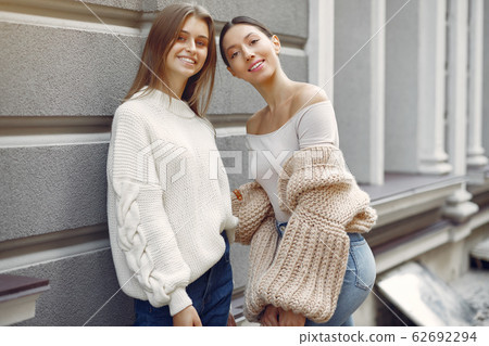 Cute girls with shopping bag in a city Cute girls with shopping bag in a city 62692294