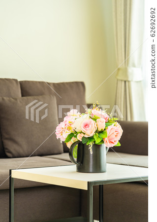 Vase flower on table with pillow and sofa decoration interior Vase flower on table with pillow and sofa decoration interior 62692692