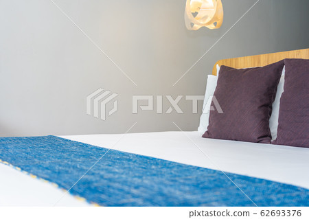 White pillow on bed decoration interior White pillow on bed decoration interior 62693376