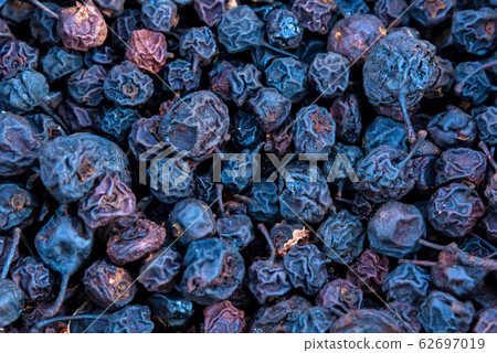 Background of many dark blue dry wild pears Background of many dark blue dry wild pears 62697019