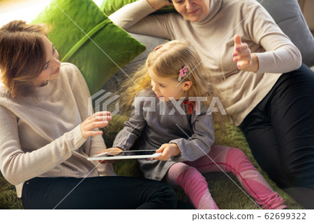 Happy loving family. Grandmother, mother and daughter spending time together 62699322