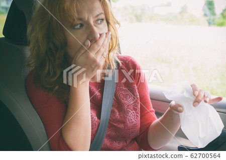 Woman suffering from motion sickness Woman suffering from motion sickness 62700564