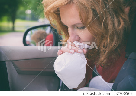 Woman suffering from motion sickness Woman suffering from motion sickness 62700565