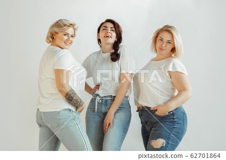 Young women in casual clothes having fun together. Bodypositive concept. 62701864