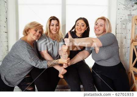 Young women in casual clothes having fun together. Bodypositive concept. 62701933