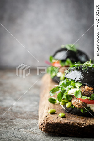 Veggie mushroom black burgers. Veggie mushroom black burgers. 62702220