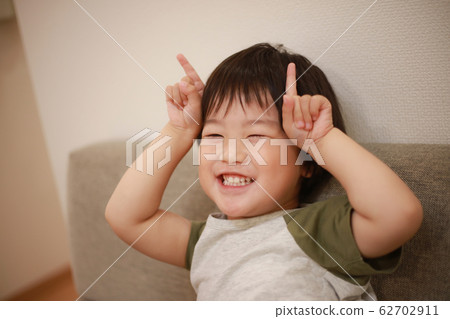 Boy playing with hands Boy playing with hands 62702911