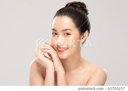 Beautiful Young Asian Woman smile feeling so happy and cheerful with healthy Clean and Fresh skin Beautiful Young Asian Woman smile feeling so happy and cheerful with healthy Clean and Fresh skin 62703257