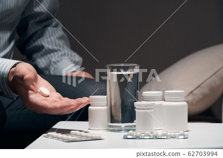 Overworked businessman sitting on the sofa and 62703994