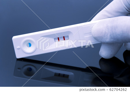 The positive result of quick urine test. The positive result of quick urine test. 62704262