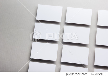 Business card blank on wooden background. Corporate Stationery, Branding Mock-up. Creative designer desk. Flat lay. Copy space for text Business card blank on wooden background. Corporate Stationery, Branding Mock-up. Creative designer desk. Flat lay. Copy space for text 62705919