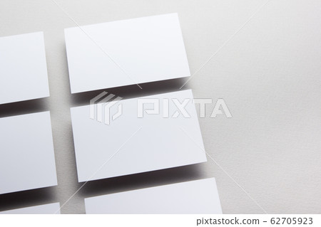 Business card blank on wooden background. Corporate Stationery, Branding Mock-up. Creative designer desk. Flat lay. Copy space for text Business card blank on wooden background. Corporate Stationery, Branding Mock-up. Creative designer desk. Flat lay. Copy space for text 62705923