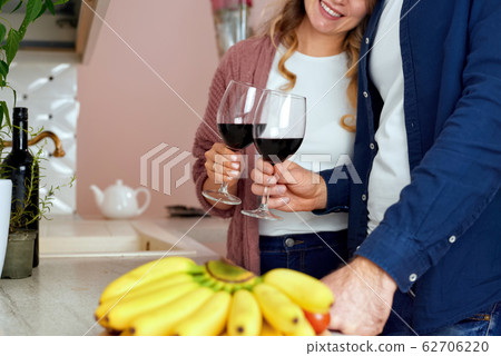 A couple in the kitchen A couple in the kitchen 62706220