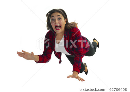 A second before falling - young girl falling down with bright emotions and expression A second before falling - young girl falling down with bright emotions and expression 62706408