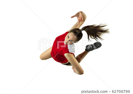 Young female volleyball player isolated on white studio background in flight and motion 62708799