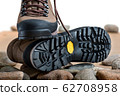 Pair of walking boots in the studio. 62708958