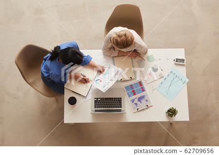 Two Businesswomen at Desk Above View 62709656