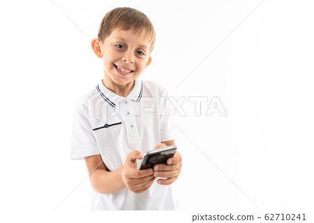 Young caucasian teenager serfing internet isolated on white background Young caucasian teenager serfing internet isolated on white background 62710241