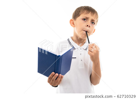 Young caucasian teenager do homework and thinks isolated on white background 62710329