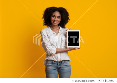 Happy Afro Girl Holding Digital Tablet With Empty Black Screen 62710860