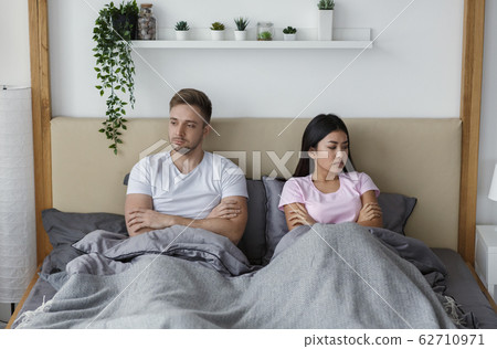 Unhappy Couple Lying In Bed Uninterested In Sexual Life Indoor Unhappy Couple Lying In Bed Uninterested In Sexual Life Indoor 62710971