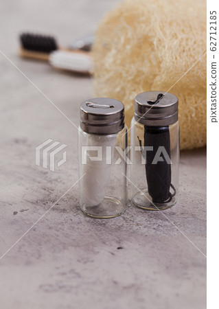 Zero waste home concept. Eco dental floss, white and black on concrete natural background 62712185