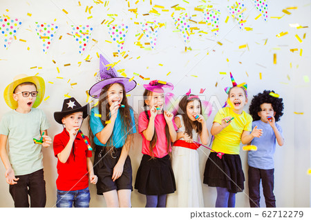 Happy birthday children girls and boys with confetti on white background Happy birthday children girls and boys with confetti on white background 62712279