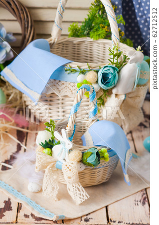 Easter baskets with flowers, composition in blue colours Easter baskets with flowers, composition in blue colours 62712512