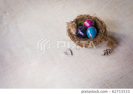 Naturally dyed Easter quail eggs in nest with 62713533