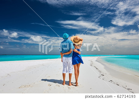 Couple in blue on a beach at Maldives Couple in blue on a beach at Maldives 62714193