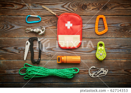 Travel items for hiking over wooden background 62714353