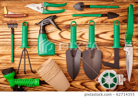 Gardening tools on wooden background flat lay 62714355