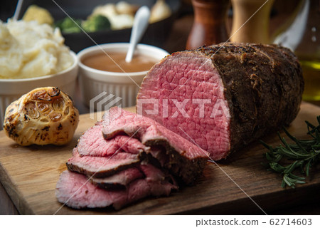 sliced eye of round beef roasted beef on cutting 62714603